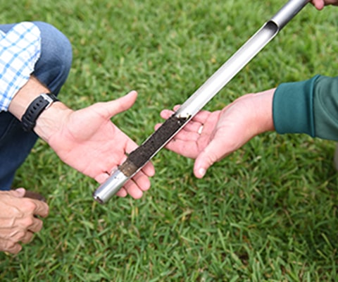 Weed Man technician performing soil test
