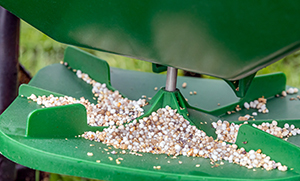 Weed Man's lawn fertilizer spreader with tines