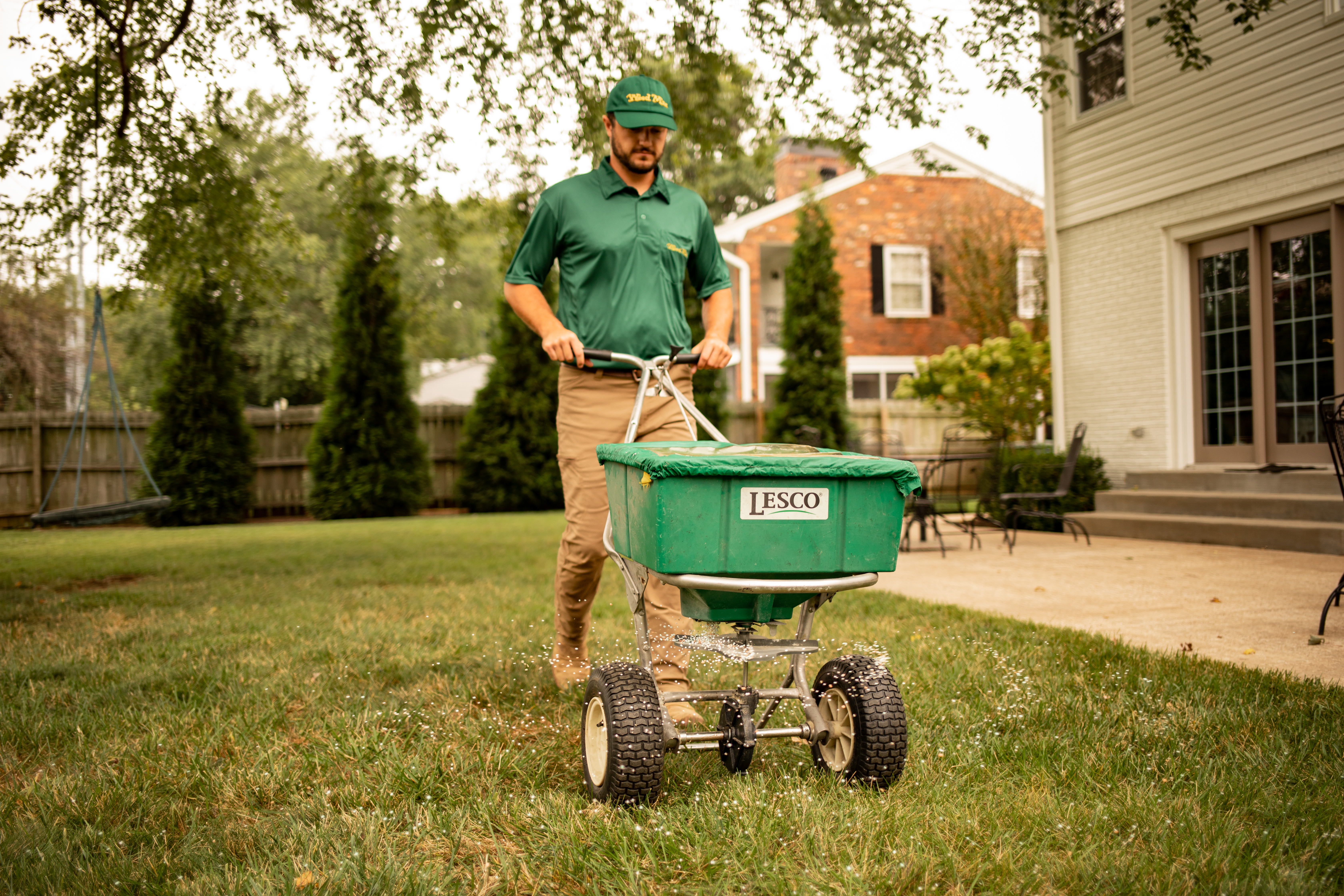 technician pushing spreader